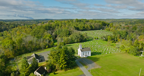 Aerial view of a cemetery in Green Lane, a small borough in Montgomery County, Pennsylvania, on an overcast day in Fall.