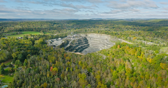 Aerial view of a large quarry in Green Lane, a small borough in Montgomery County, Pennsylvania, on an overcast day in Fall.