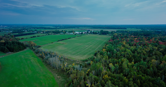 Aerial shot of scenery in Cheboygan County, Michigan, on an overcast evening in Fall.