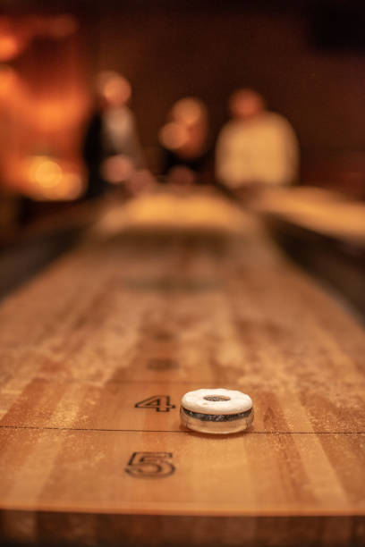 istock Playing the game of shuflleboard.. 1895419162