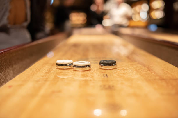 istock Playing the game of shuflleboard.. 1895419175