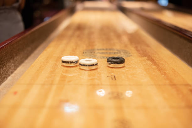 istock Playing the game of shuflleboard.. 1895419680
