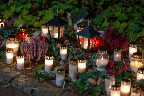 istock Grave candles on a cemetery on all saints eve.. 1895427435