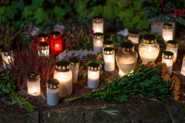 istock Grave candles on a cemetery on all saints eve.. 1895427436
