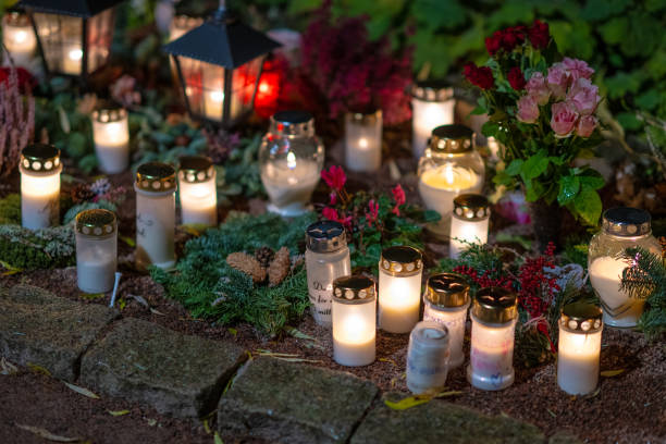 istock Grave candles on a cemetery on all saints eve.. 1895427443