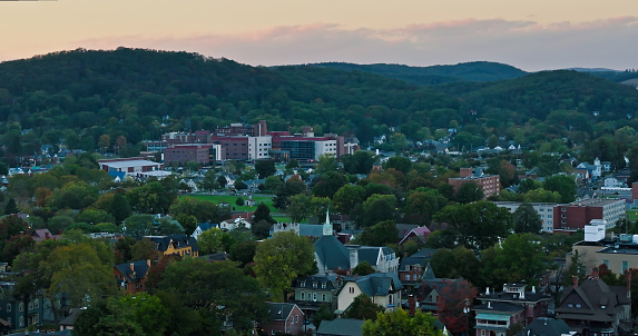 Aerial establishing shot of Williamsport in Lycoming County, Pennsylvania on a Fall evening. Authorization was obtained from the FAA for this operation in restricted airspace.