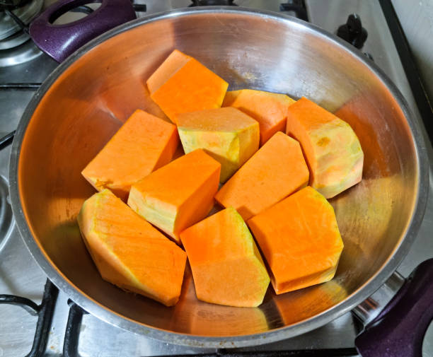 istock Pumpkin cut into small pieces in pan 1895578985
