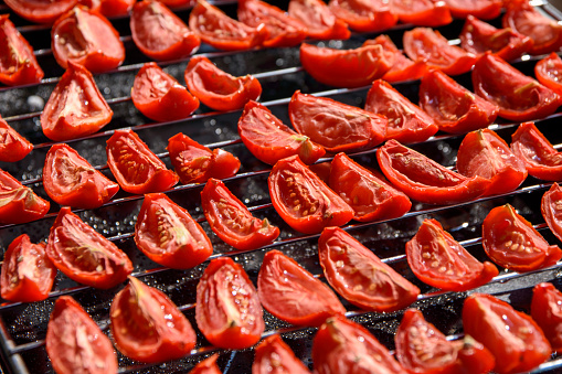 Tomatoes sliced and dried under the sun for drying