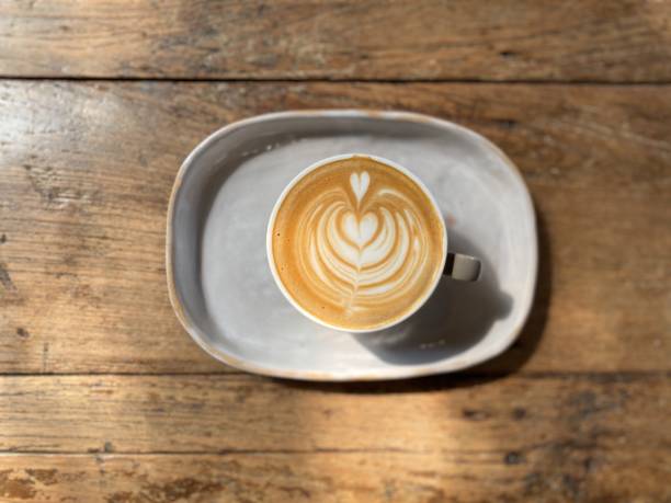 istock Cup of coffee  on wooden table , Top view 1895694078