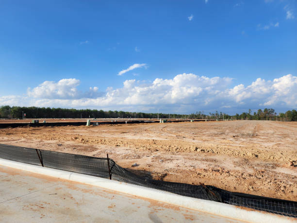 istock New housing development with lots cleared and roads completed.  Utilities have been installed, just awaiting the new construction planned for the area. 1895700318