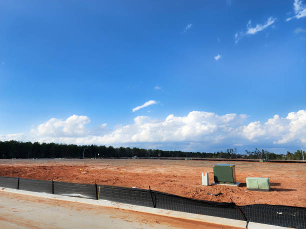 istock New housing development with lots cleared and roads completed.  Utilities have been installed, just awaiting the new construction planned for the area. 1895700324