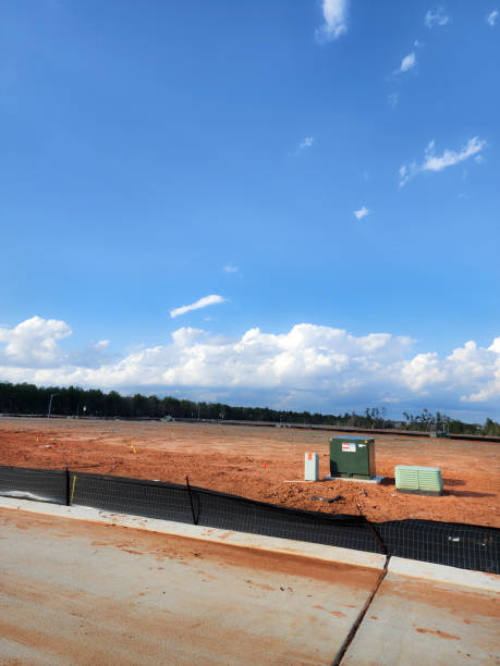 istock New housing development with lots cleared and roads completed.  Utilities have been installed, just awaiting the new construction planned for the area. 1895700326