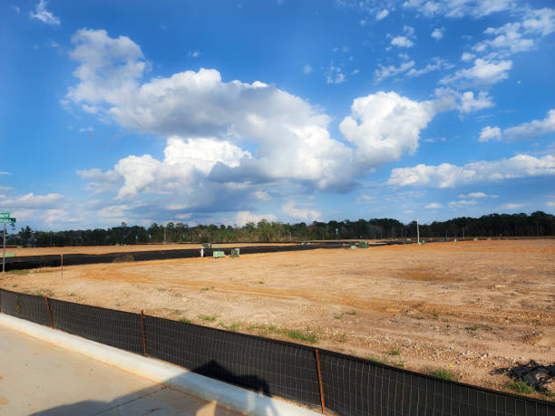 istock New housing development with lots cleared and roads completed.  Utilities have been installed, just awaiting the new construction planned for the area. 1895700329