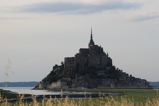 Saint Mont Michel Abbey at evenfall in Normandy, France, on the 1000 year anniversary of its conception.
