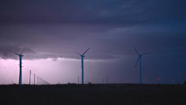 istock Thunderstorm over wind farm. Renewable energy concept. copy space 1895817051