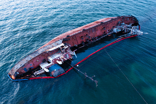 Tempest's Toll: Aerial View of Storm-Distressed Capsized Tanker