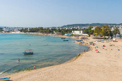 Sandy beach in Hammamet with lots of traditional fishing boat.Tunisia