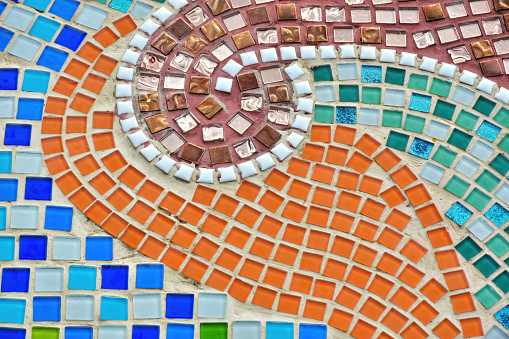 Colorful of tile-shard mosaic and stone decorating on the wall for abstract background