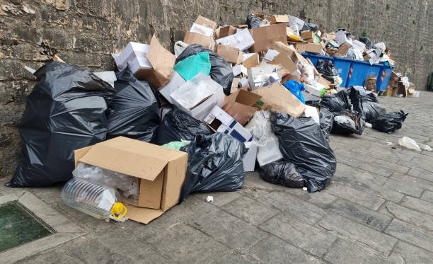 istock garbages garbage buckets full platic bags boxes on the street 1896320741