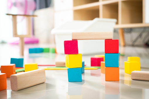 Colorful toy blocks for kids. Wooden construction toy for preschool learning.