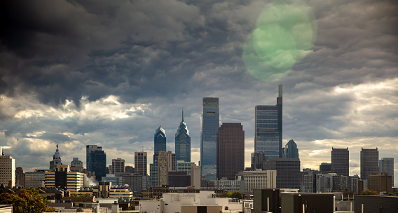 Aerial shot of the downtown Philadelphia skyline, on a cloudy day in Fall. This still image is part of a series taken at different times of day from the same location; a time lapse is also available. Authorization was obtained from the FAA for this operation in restricted airspace.