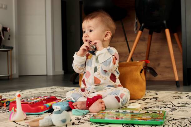 istock A cute charming baby is playing with a toy 1896614831