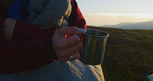 istock Female tourist holding cup with tea in hands 1896642599