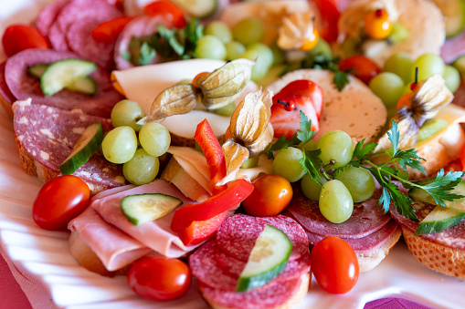 a mixture of sandwiches with fruit in selective focus