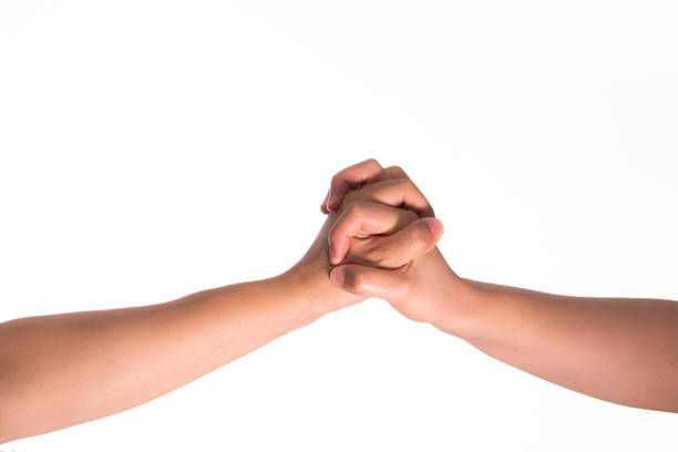 istock Two hands hold tightly together in different pose on isolated white background 1896691385