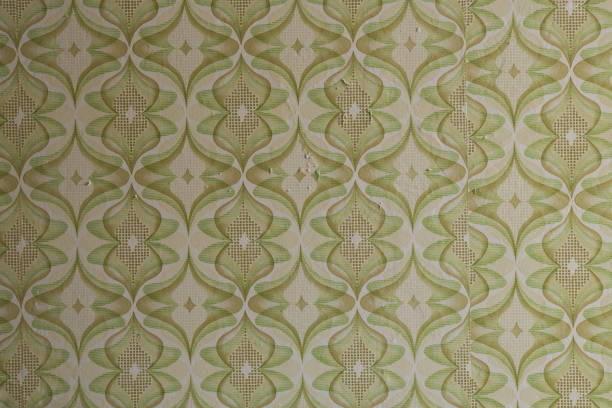 istock Old wallpaper on the wall. Old wallpaper for texture or background. 1896771111