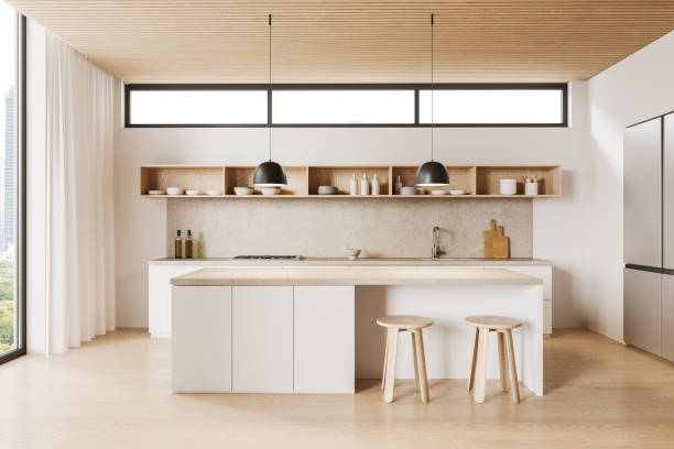 istock Modern home kitchen interior with bar counter and shelf with dishes, window 1896774719
