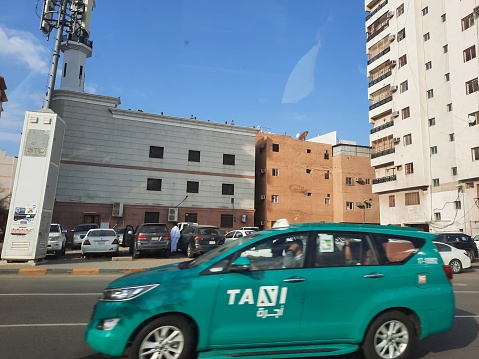 Beautiful daytime view of Green Taxis on Mohammed bin Salman street street near Masjid al-Haram in Mecca.