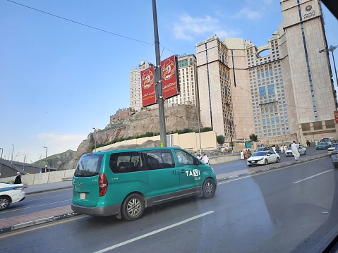 Beautiful daytime view of Green Taxis on Mohammed bin Salman street street near Masjid al-Haram in Mecca.