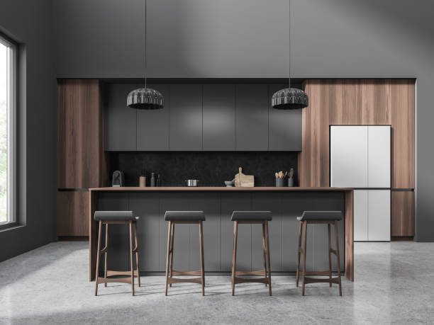 istock Dark home kitchen interior with bar counter, cooking space and window 1896813747