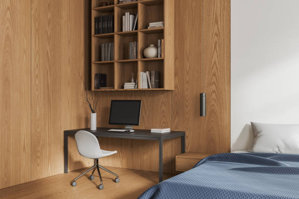 istock White and wooden bedroom corner with workplace 1896816088