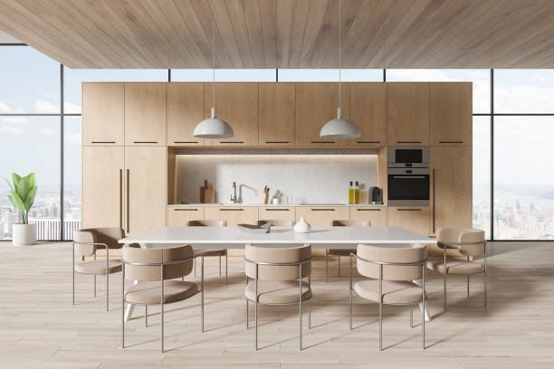 istock Wooden home kitchen interior with dining table, cooking shelves and window 1896822769