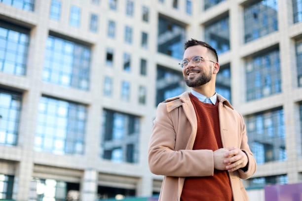 istock Smiling man on a city street 1896855256