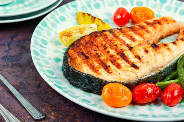 istock Grilled trout steak on a plate. 1896935663