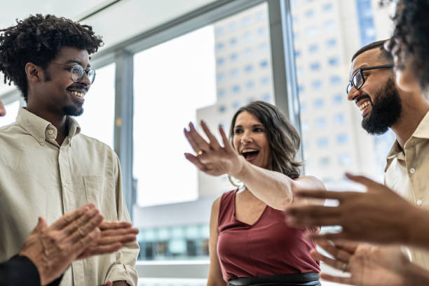 istock Coworkers celebrating on the office 1896973420