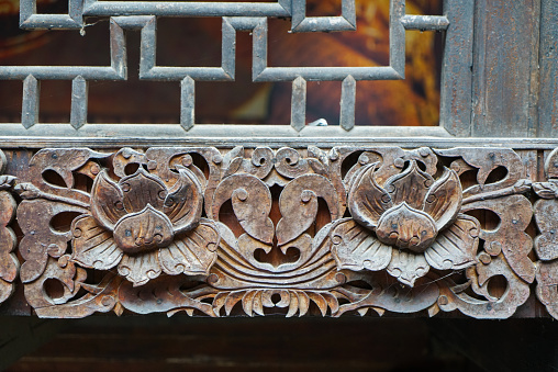 Cornice carvings. It has a flower shape and a metallic rust feel. Enshi Tushi Castle is a unique Tujia Tushi cultural site. Hubei, China.
