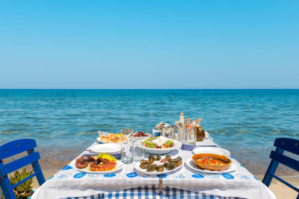 Tables with chairs in traditional Greek taverna in Kissamos town on coast of Crete island. Greece