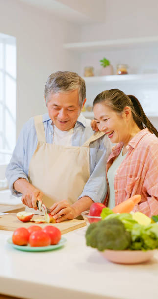 istock Asian elderly couple in kitchen 1897017569