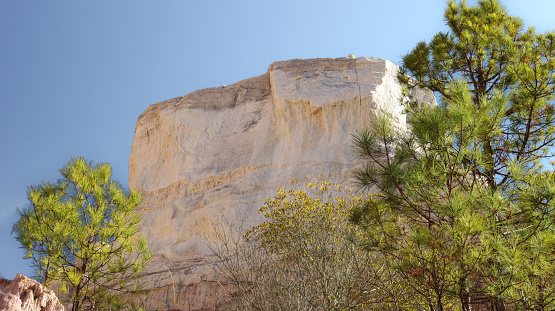 A column/platform of white sandstone photographed from the canyon floor at Providence Canyon State Park in Lumpkin, Georgia.