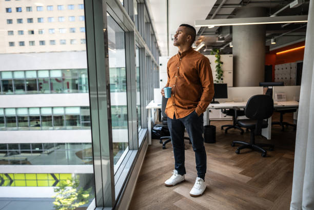 istock Businessman looking at view on the office 1897052253