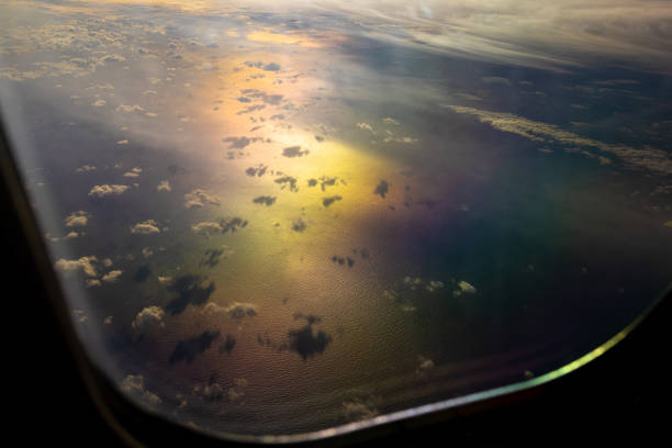 clouds over the ocean as seen from an airplane window