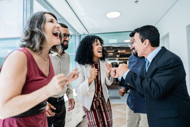 istock Coworkers celebrating on the office 1897084626