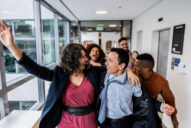 istock Coworkers celebrating on the office 1897085145