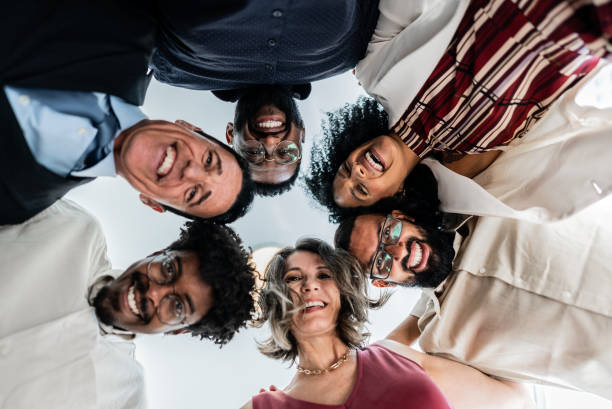 istock Low angle view of coworkers huddling on the office 1897085158