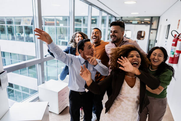 istock Coworkers celebrating on the office 1897095573