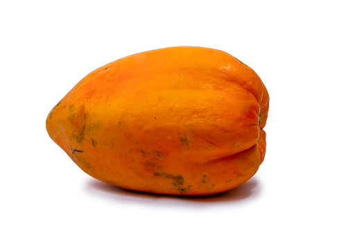 whole papaya fruit isolated on white background